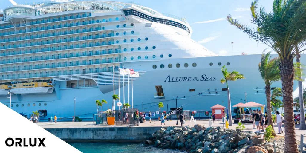 Large cruise ship docked by shore at port canaveral