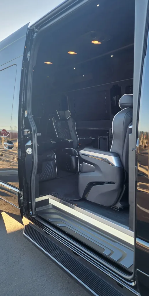 Luxury van interior with spacious seating.