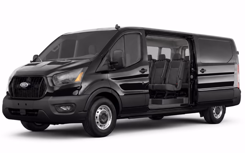 Black Ford Transit 10-passenger van with its sliding door open, showing rows of seats