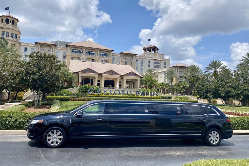 Black Lincoln MKT stretch limousine parked in front of the Gaylord Palms Resort sign in Kissimmee